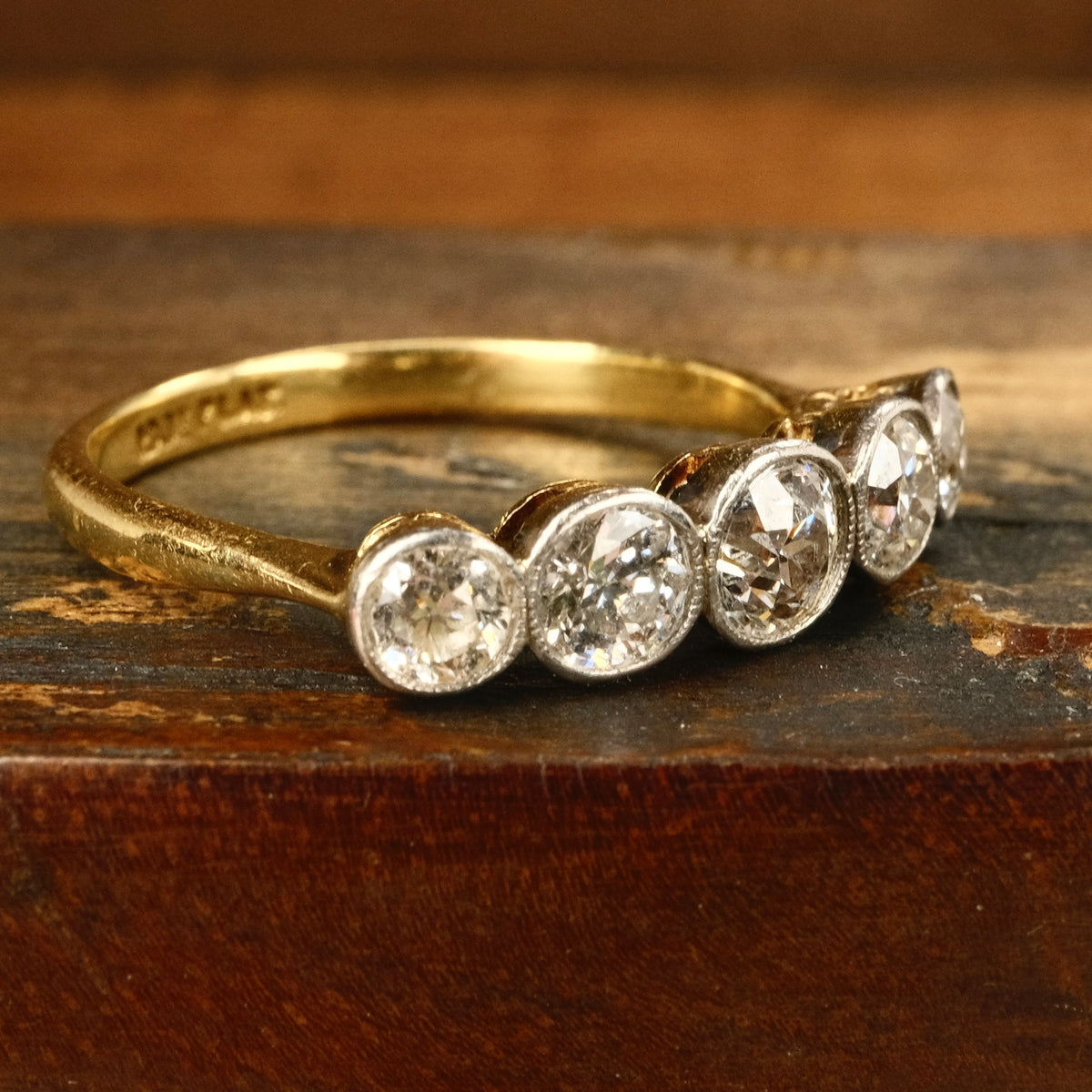 1920s, Art Deco, 1.3 Carats, Bezel Set 5 stone Old European Cut Diamond 18ct Gold & Platinum Ring