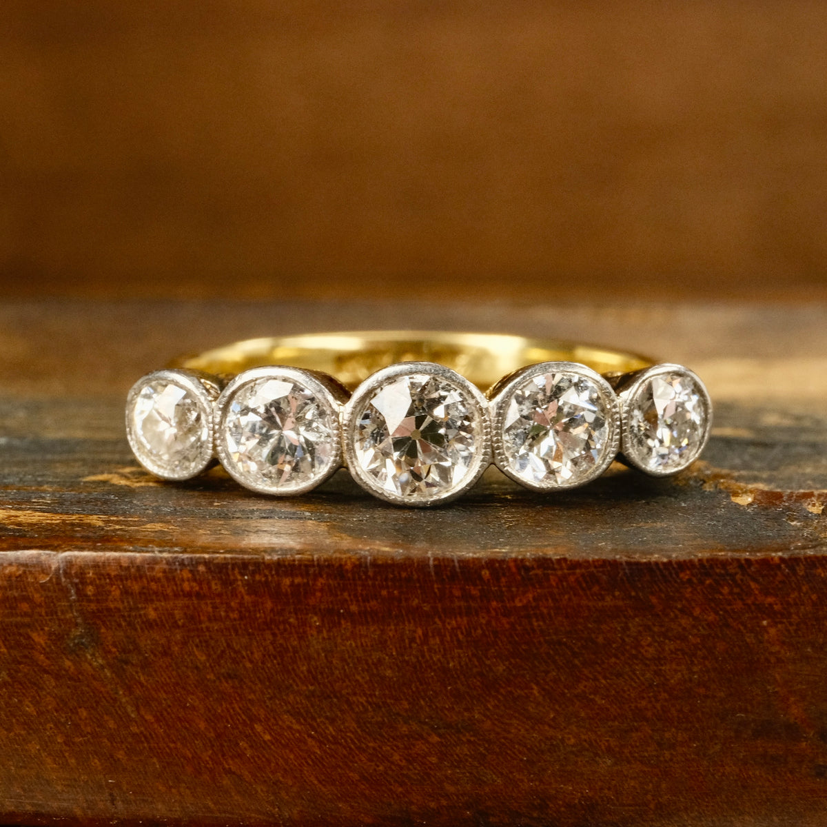 1920s, Art Deco, 1.3 Carats, Bezel Set 5 stone Old European Cut Diamond 18ct Gold & Platinum Ring