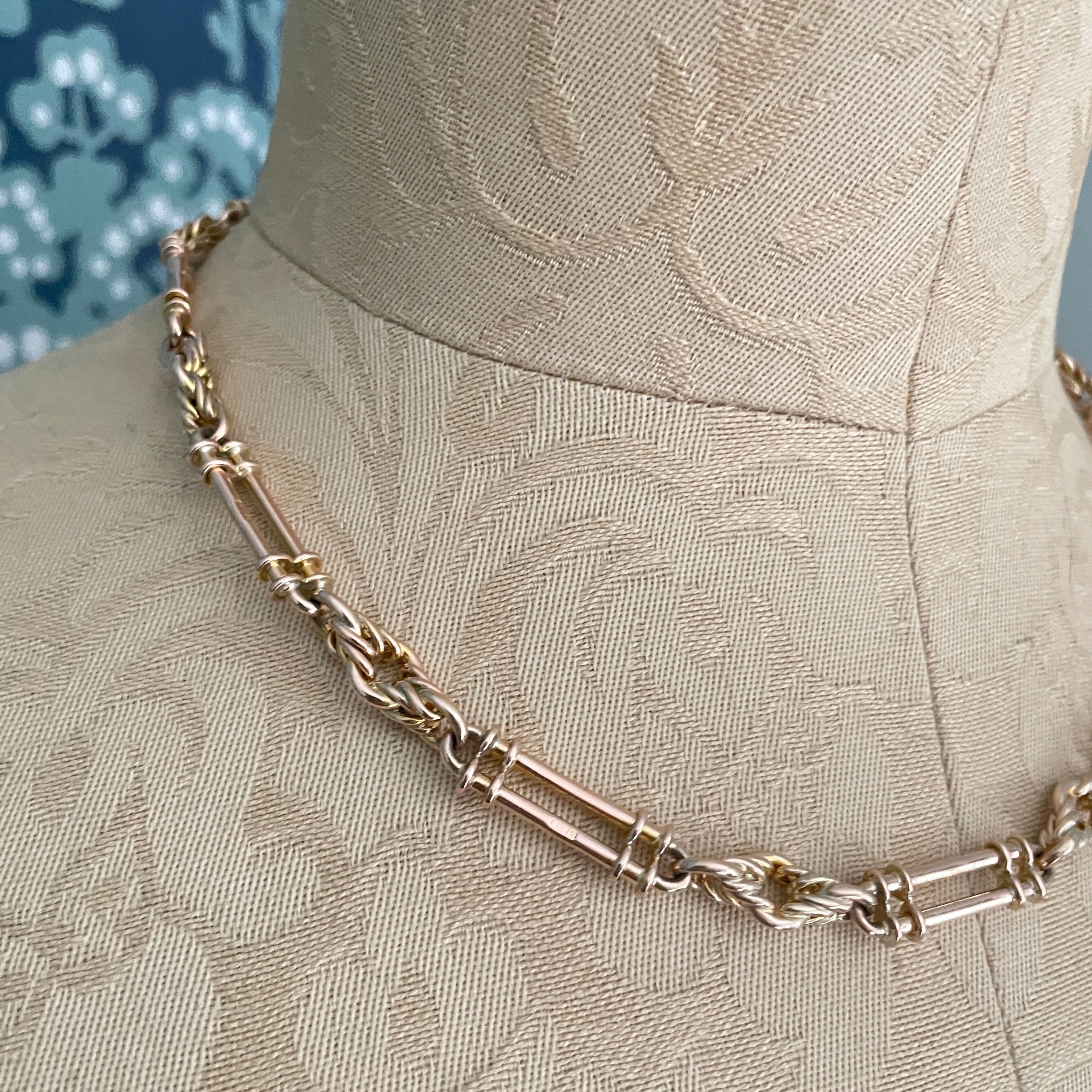 Antique trombone and lover knot link chain