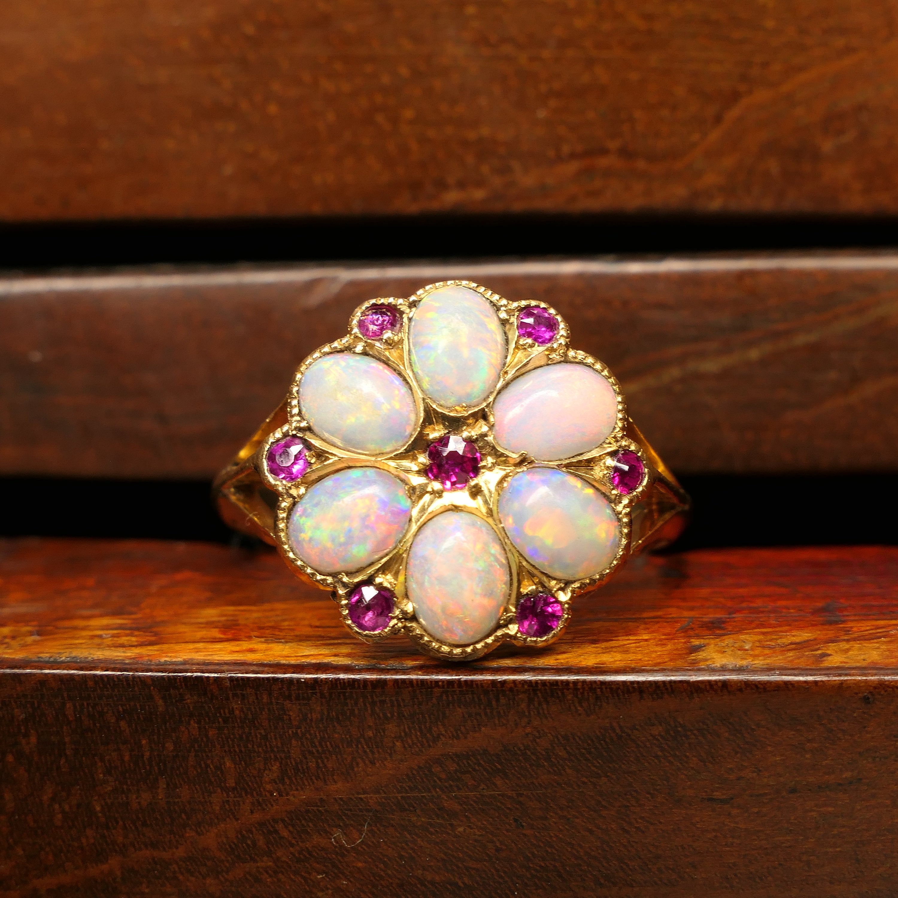 Edwardian, opal and ruby daisy cluster ring